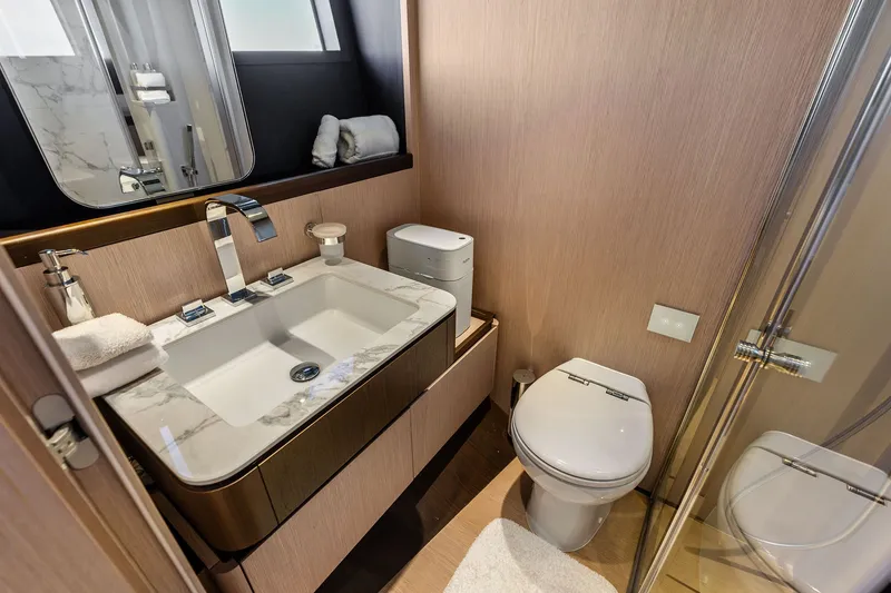Slide: The Image of Luxurious bathroom in 2024 Ferretti Yachts 860, featuring modern sink and toilet. - 94