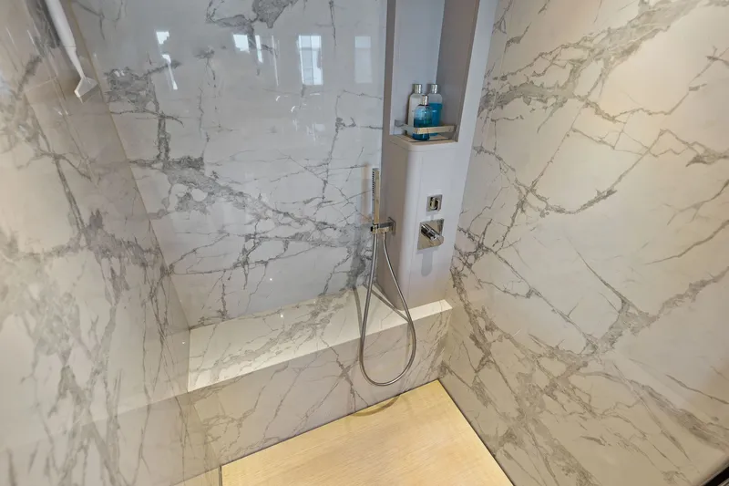 Slide: The Image of Luxurious marble shower in 2024 Ferretti Yachts 860, featuring modern fixtures and elegant design. - 82