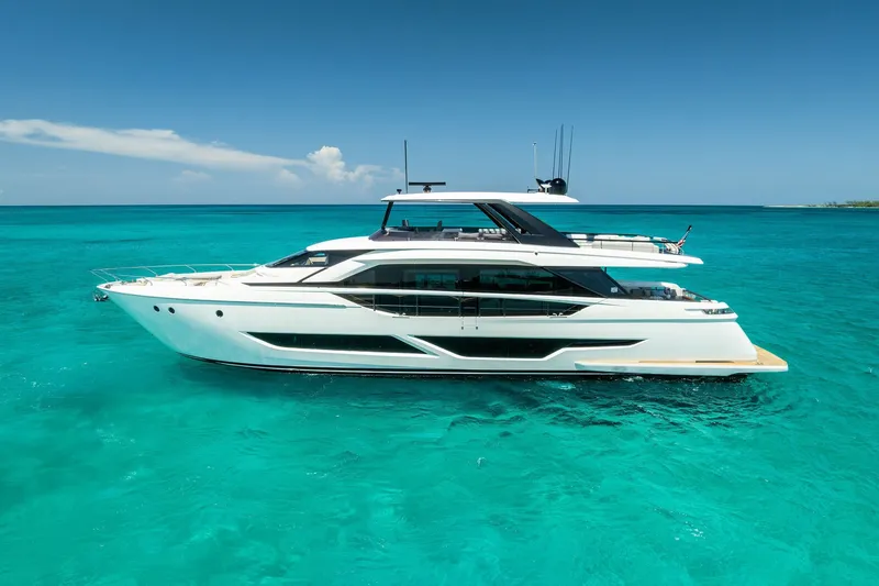 Slide: The Image of 2024 Ferretti Yachts 860 cruising on clear turquoise waters under a bright blue sky. - 2