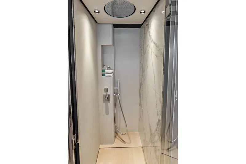 Slide: The Image of Luxurious shower in 2024 Ferretti Yachts 860, featuring modern fixtures and elegant marble walls. - 89