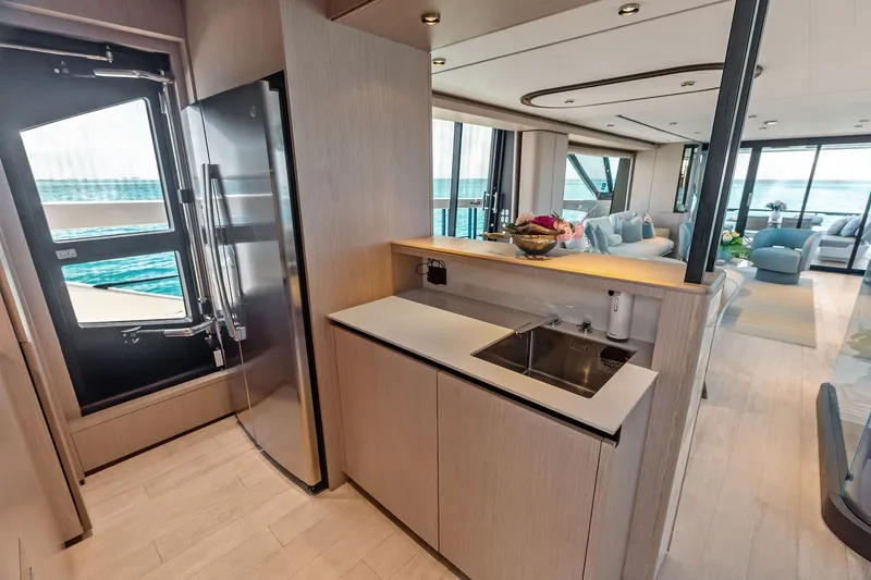 Slide: The Image of Luxurious interior of 2024 Ferretti Yachts 860, featuring modern kitchen and spacious living area. - 62