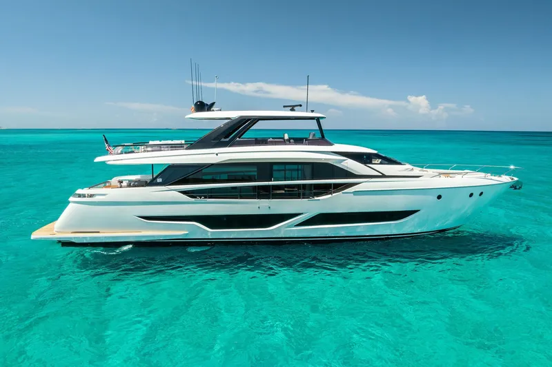 The Image of Luxurious 2024 Ferretti Yachts 860 cruising on clear turquoise waters. - 0