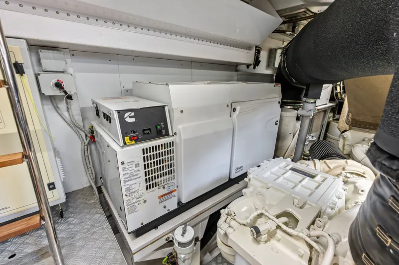 Slide: The Image of Engine room of 2024 Ferretti Yachts 860, featuring Cummins generator and advanced machinery. - 111