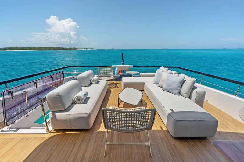 Slide: The Image of Luxurious 2024 Ferretti Yachts 860 deck with elegant seating and stunning ocean view. - 40