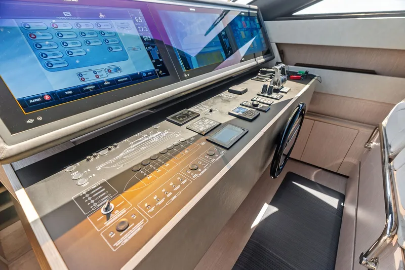 Slide: The Image of 2024 Ferretti Yachts 860 helm with advanced navigation controls and touchscreen displays. - 69