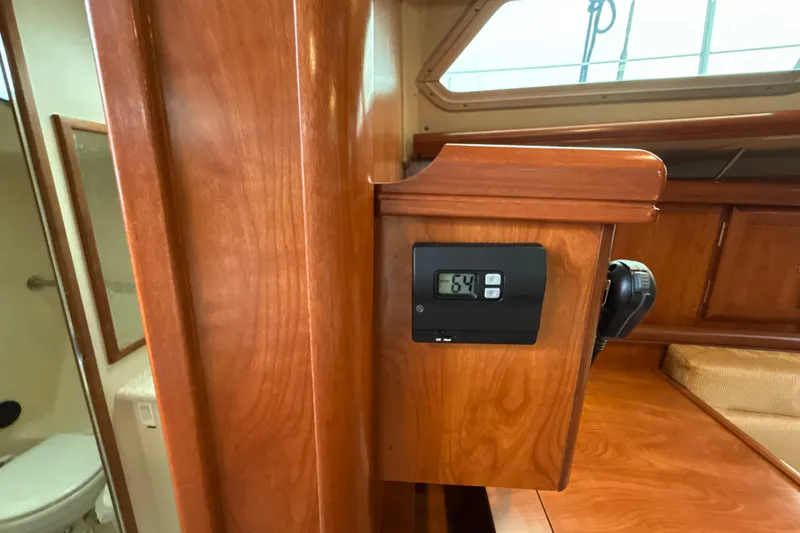 Slide: The Image of Interior of 2010 Hunter 36 yacht with wooden cabinetry and digital display. - 22