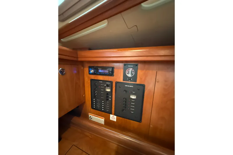 Slide: The Image of Electrical panel and stereo system in 2010 Hunter 36 yacht interior. - 21