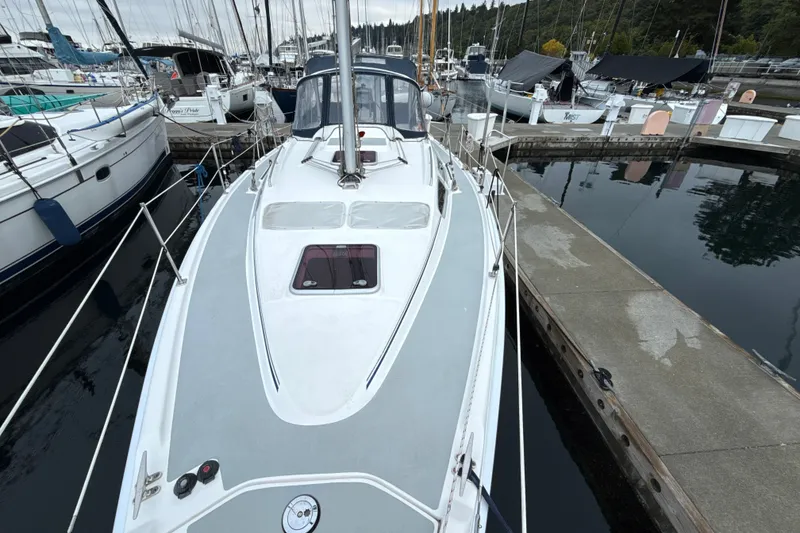 Slide: The Image of Sailboat Hunter 36, 2010 model, docked at marina with surrounding boats. - 37