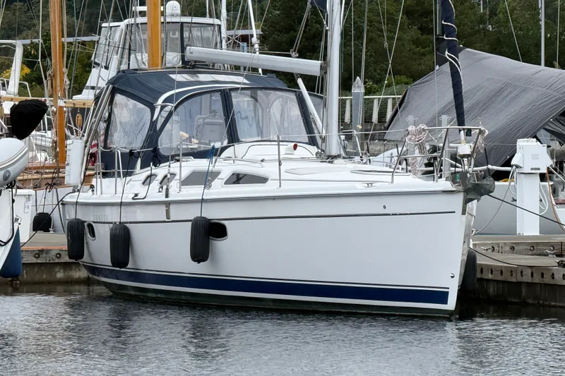 The Image of 2010 Hunter 36 sailboat docked at marina, featuring sleek design and modern amenities. - 0