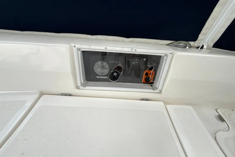 Slide: The Image of Control panel of a 2010 Hunter 36 sailboat featuring Yanmar engine gauges. - 27
