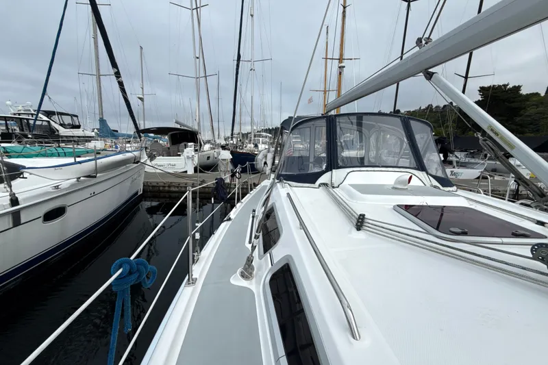 Slide: The Image of Hunter 36 sailboat from 2010 docked among other boats in a marina. - 32