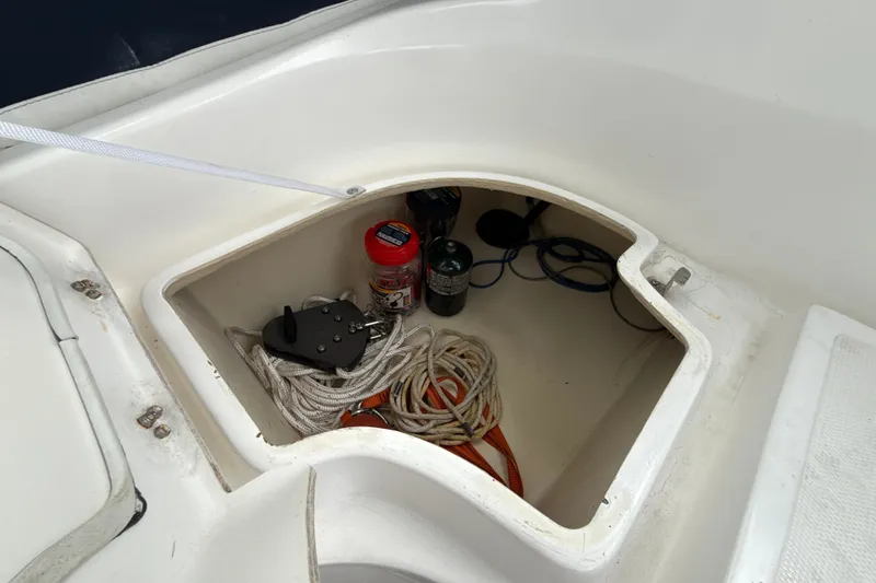 Slide: The Image of Storage compartment on a 2010 Hunter 36 sailboat with ropes and supplies. - 25