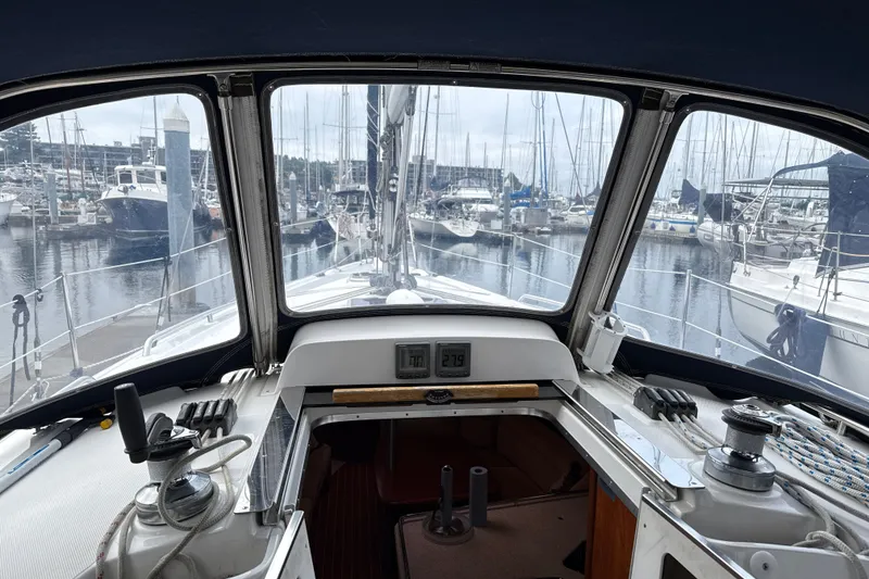 Slide: The Image of Interior view of a 2010 Hunter 36 sailboat cockpit at a marina. - 23