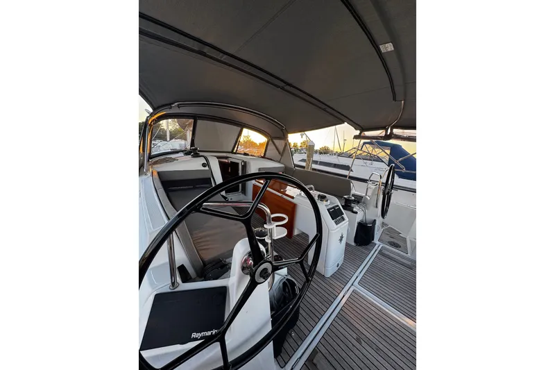 Slide: The Image of 2022 Jeanneau Sun Odyssey 440 yacht cockpit with dual steering wheels and modern design. - 21