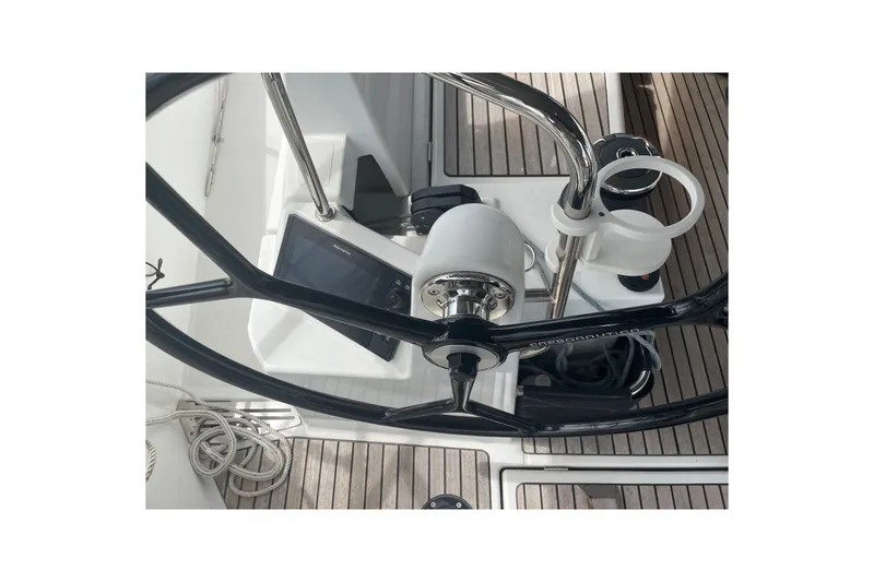 Slide: The Image of Steering wheel and controls of 2022 Jeanneau Sun Odyssey 440 sailboat cockpit. - 24