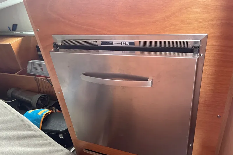 Slide: The Image of Stainless steel fridge in 2022 Jeanneau Sun Odyssey 440 yacht interior. - 13