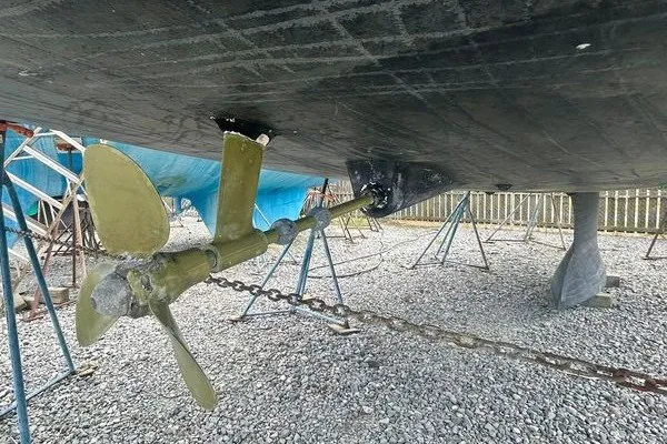 Slide: The Image of Underwater view of 2022 Jeanneau Sun Odyssey 440 propeller and hull on dry dock. - 34