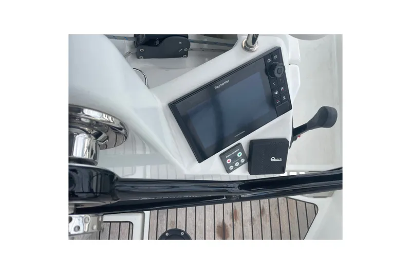 Slide: The Image of Cockpit controls of 2022 Jeanneau Sun Odyssey 440 sailboat, featuring navigation equipment. - 23