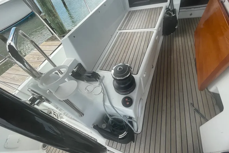 Slide: The Image of Cockpit of 2022 Jeanneau Sun Odyssey 440 with teak flooring and winch. - 16