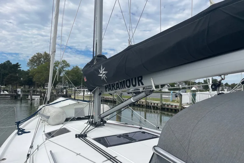 Slide: The Image of 2022 Jeanneau Sun Odyssey 440 sailboat docked, featuring sleek design and modern rigging. - 26