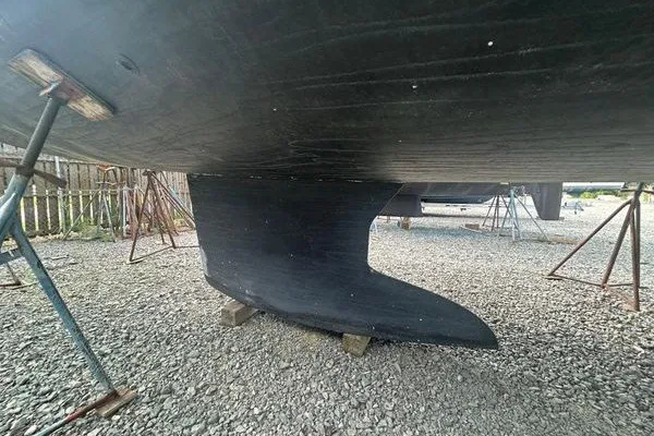 Slide: The Image of 2022 Jeanneau Sun Odyssey 440 keel on gravel, supported by stands. - 33