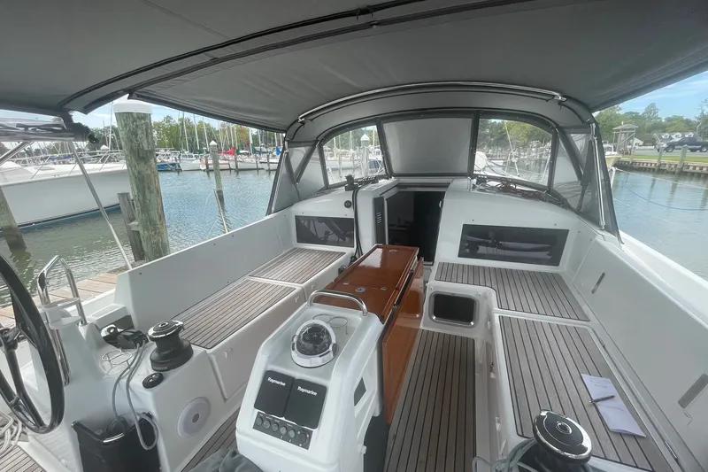 Slide: The Image of Interior view of 2022 Jeanneau Sun Odyssey 440 sailboat cockpit at marina. - 1