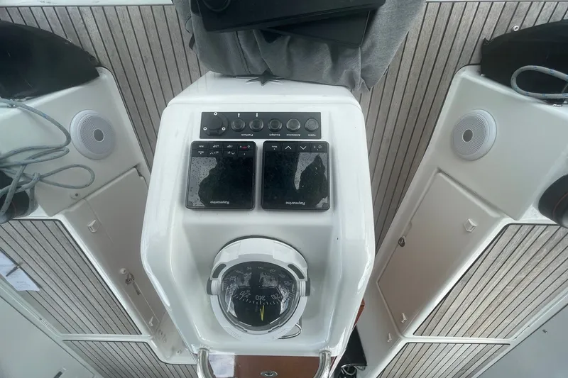 Slide: The Image of Cockpit of 2022 Jeanneau Sun Odyssey 440 with navigation instruments and compass. - 20