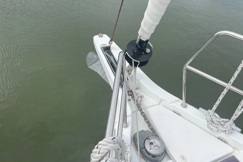Slide: The Image of Bow of 2022 Jeanneau Sun Odyssey 440 sailboat with anchor and railing details. - 28