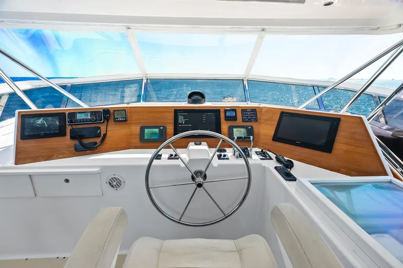 Slide: The Image of Helm of 2005 Grand Banks 72 Aleutian RP yacht with navigation equipment and ocean view. - 161