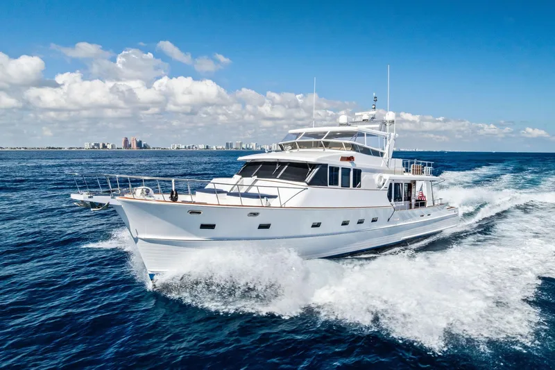Slide: The Image of 2005 Grand Banks 72 Aleutian RP yacht cruising on open sea under clear skies. - 189