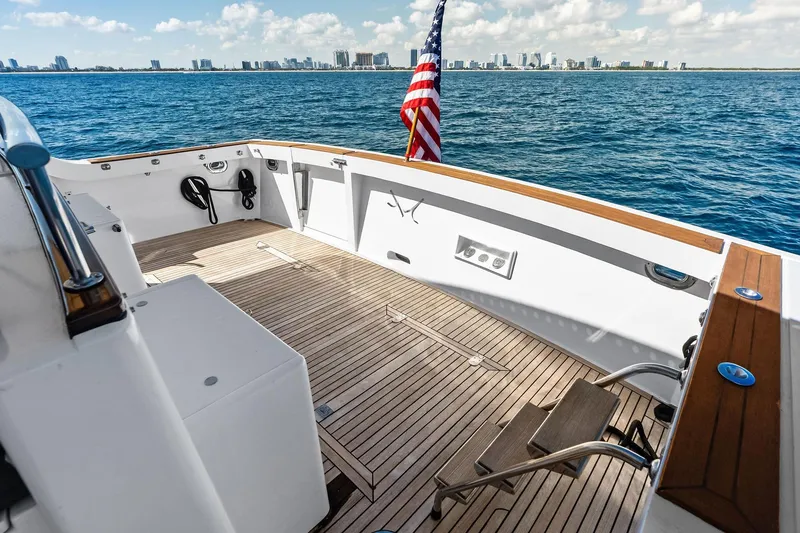 Slide: The Image of 2005 Grand Banks 72 Aleutian RP yacht deck with ocean view and city skyline. - 175