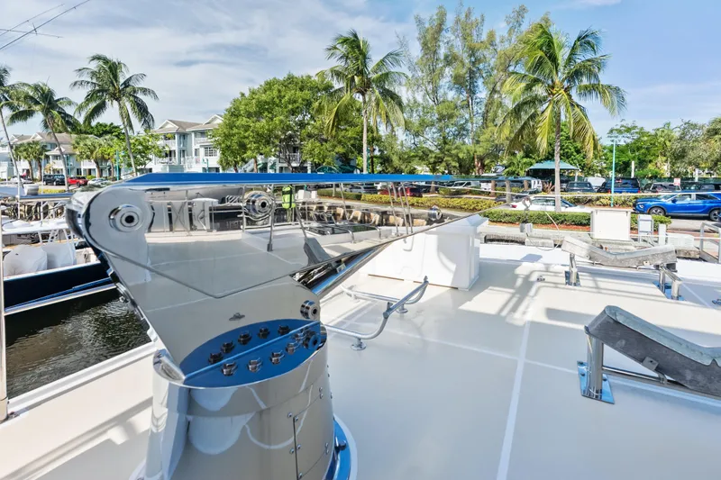 Slide: The Image of 2005 Grand Banks 72 Aleutian RP yacht deck with palm trees and marina view. - 134