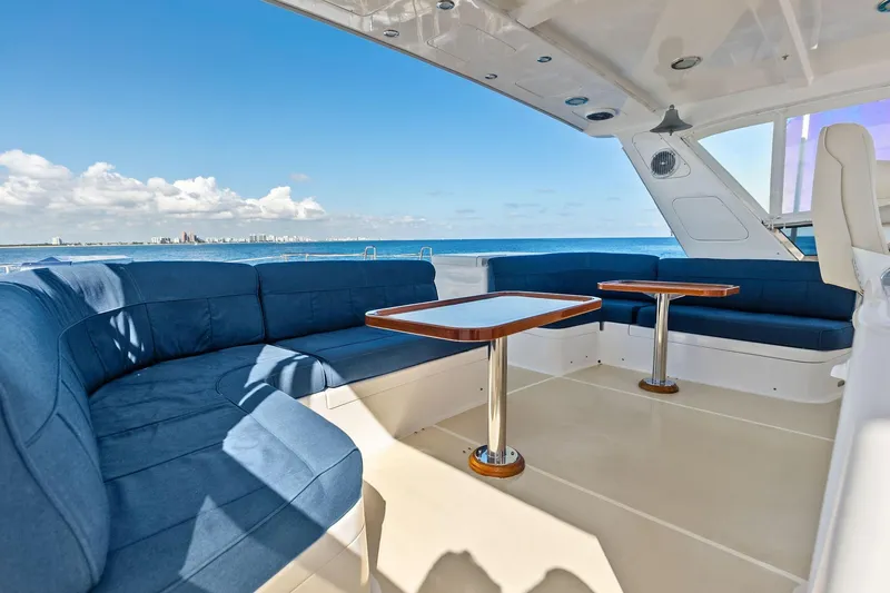 Slide: The Image of Luxurious 2005 Grand Banks 72 Aleutian RP yacht deck with blue seating and ocean view. - 156
