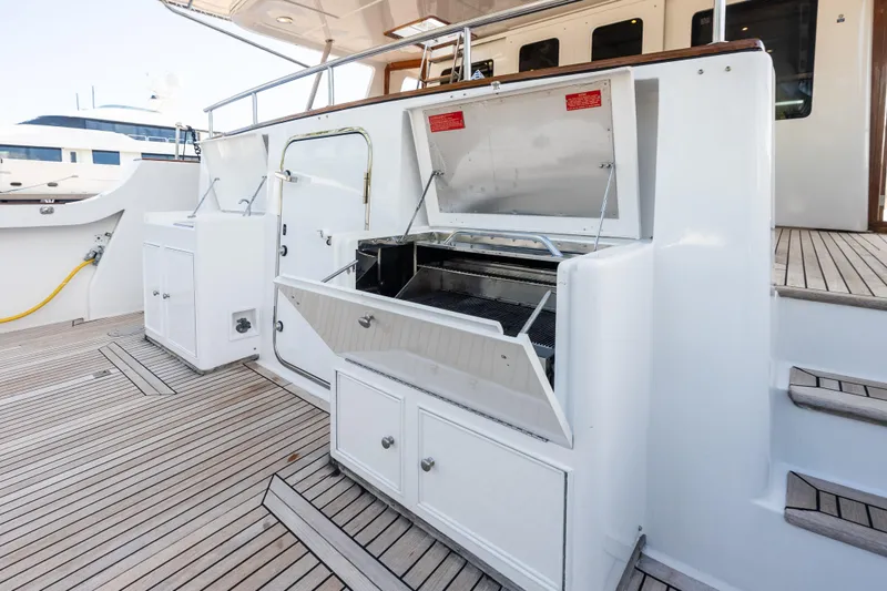 Slide: The Image of Outdoor grill area on 2005 Grand Banks 72 Aleutian RP yacht deck. - 45