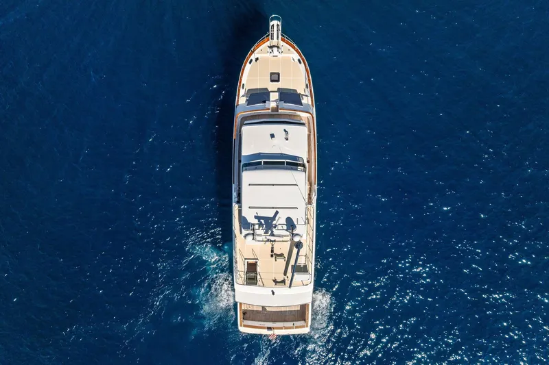 Slide: The Image of Aerial view of 2005 Grand Banks 72 Aleutian RP yacht cruising in blue ocean. - 190