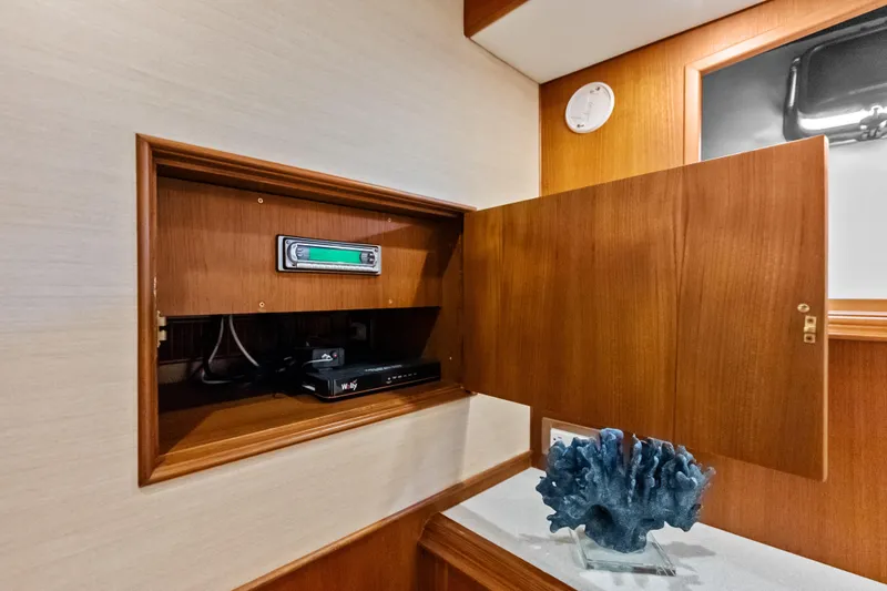 Slide: The Image of Wooden cabinet with electronic equipment inside, aboard 2005 Grand Banks 72 Aleutian RP yacht. - 103