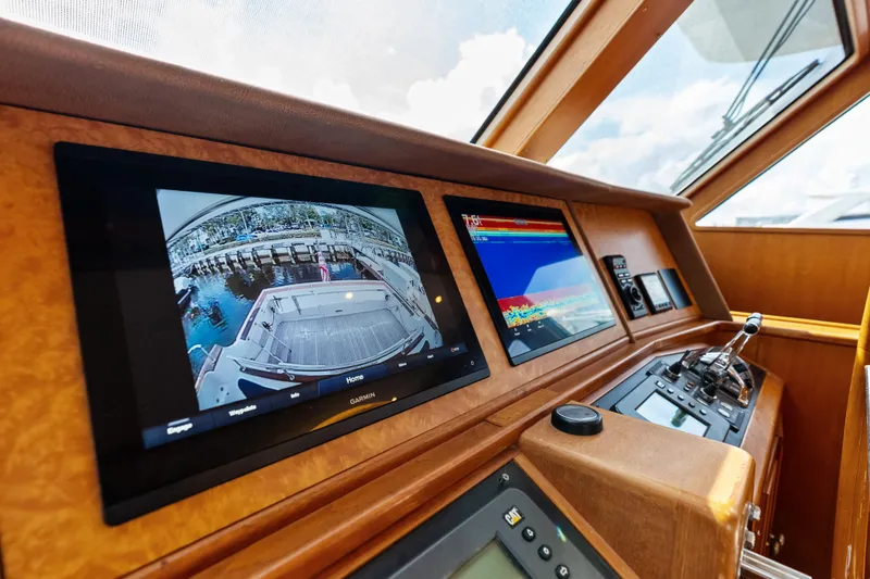 Slide: The Image of Control panel of 2005 Grand Banks 72 Aleutian RP yacht with navigation screens. - 85