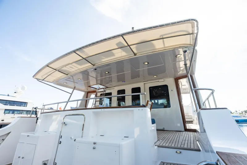 Slide: The Image of 2005 Grand Banks 72 Aleutian RP yacht, rear deck view with canopy and seating area. - 39