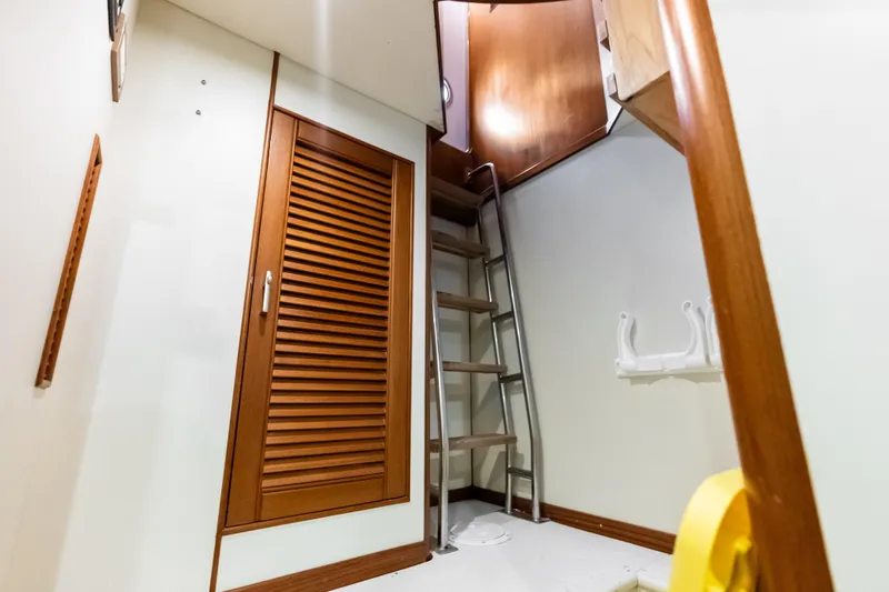 Slide: The Image of Interior of 2005 Grand Banks 72 Aleutian RP yacht with wooden ladder and storage. - 152