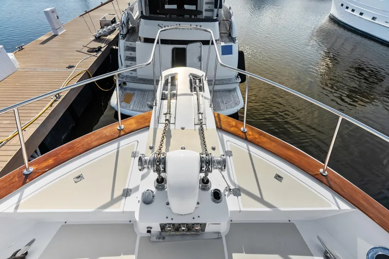 Slide: The Image of Bow view of 2005 Grand Banks 72 Aleutian RP yacht docked at marina. - 123