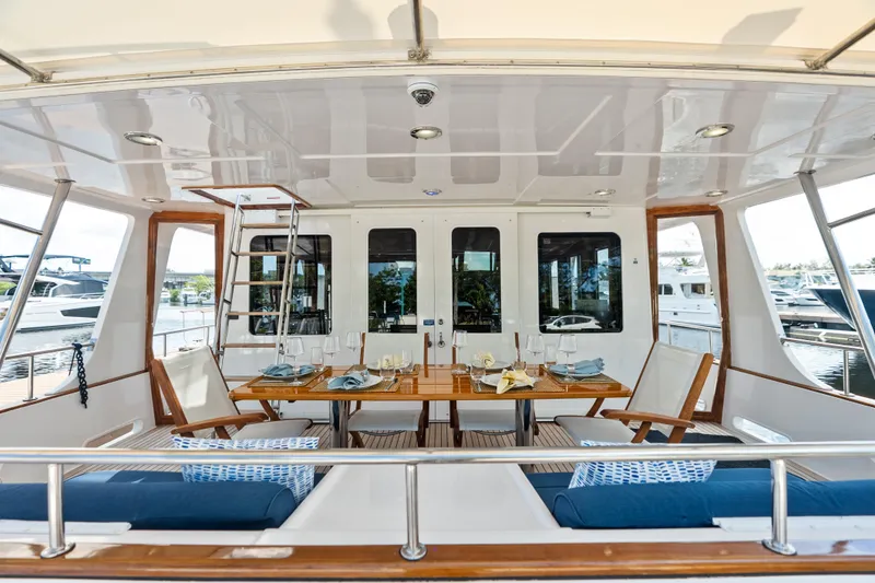 Slide: The Image of Luxurious 2005 Grand Banks 72 Aleutian RP yacht with elegant outdoor dining area. - 48
