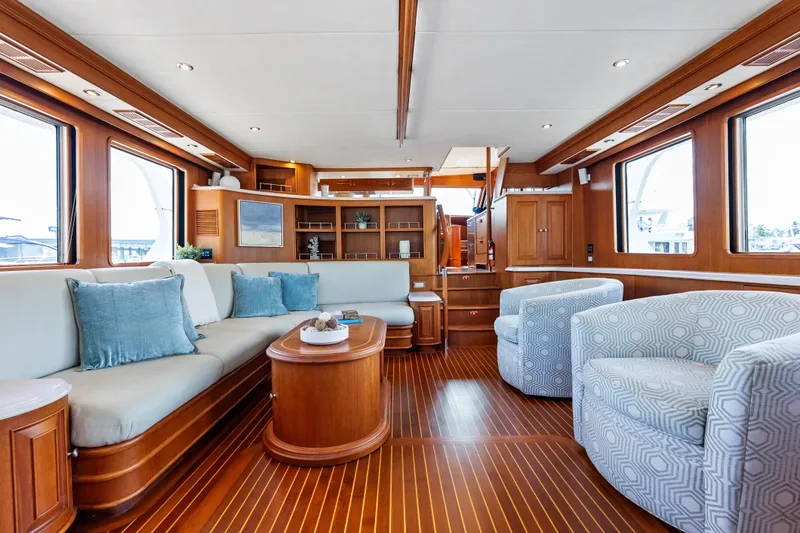 Slide: The Image of Luxurious 2005 Grand Banks 72 Aleutian RP yacht interior with elegant wood finishes and plush seating. - 61