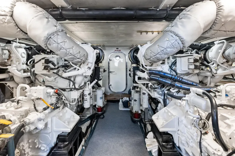 Slide: The Image of Engine room of 2005 Grand Banks 72 Aleutian RP yacht, featuring dual engines. - 149