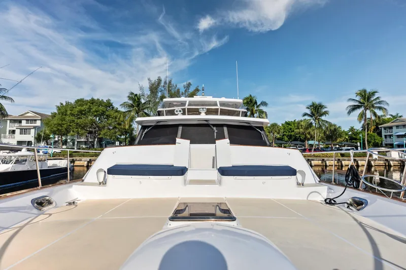 Slide: The Image of 2005 Grand Banks 72 Aleutian RP yacht docked, featuring spacious deck and modern design. - 118