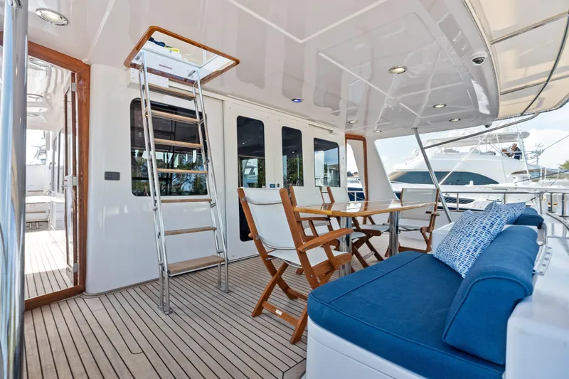 Slide: The Image of Luxurious 2005 Grand Banks 72 Aleutian RP yacht deck with seating and dining area. - 49