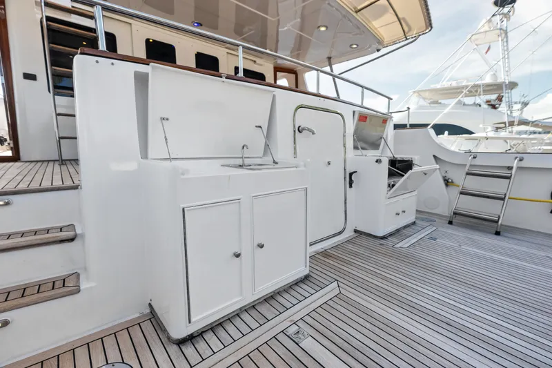 Slide: The Image of 2005 Grand Banks 72 Aleutian RP yacht deck with outdoor kitchen and seating area. - 47