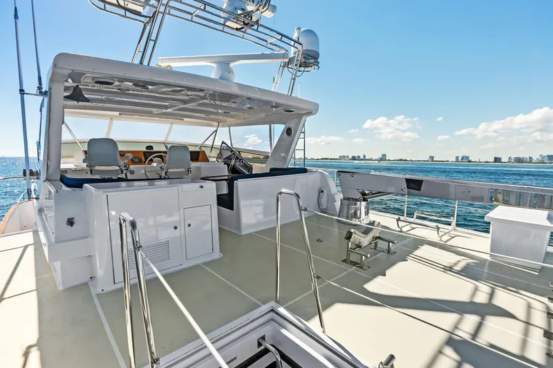 Slide: The Image of 2005 Grand Banks 72 Aleutian RP yacht deck with ocean view and clear sky. - 159