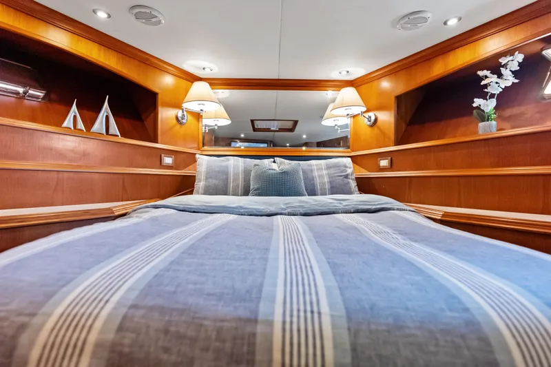 Slide: The Image of Luxurious cabin interior of 2005 Grand Banks 72 Aleutian RP yacht with cozy bedding. - 109