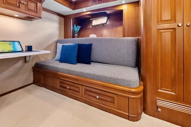 Slide: The Image of Luxurious interior of 2005 Grand Banks 72 Aleutian RP yacht with cozy seating and elegant wood finish. - 94