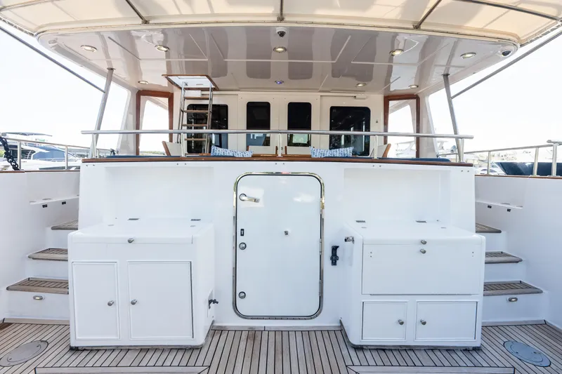 Slide: The Image of 2005 Grand Banks 72 Aleutian RP yacht deck with stairs and storage compartments. - 40